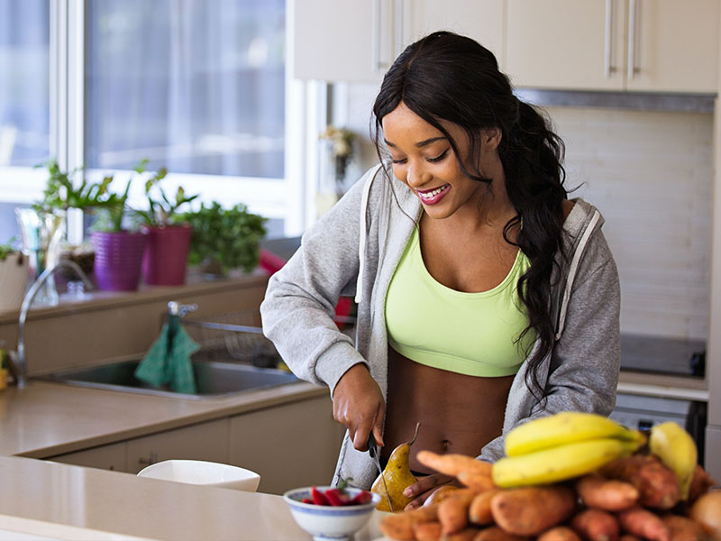 Active Woman Preparing a Healthy Meal for Wellness